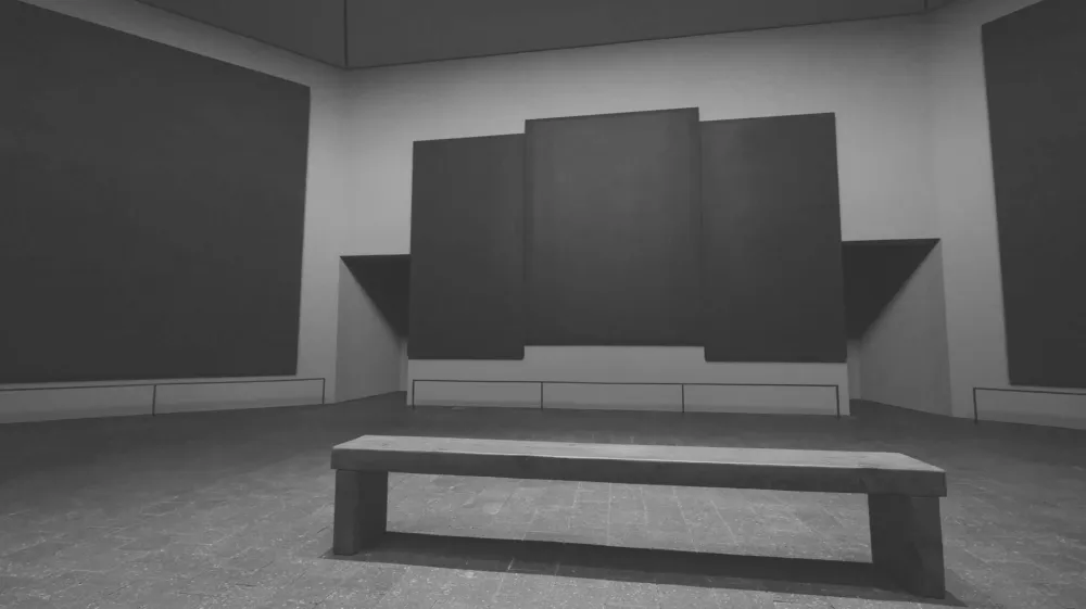 The interior of Rothko Chapel, with dark paintings surrounding a central bench